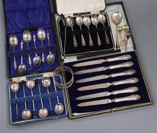Four assorted cased sets of silver cutlery (one incomplete), five silver spoons and a silver napkin ring.
